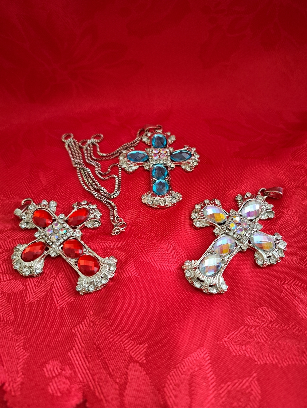 Three Crystal Cross Pendant Necklace Pendants Red, Blue, and Iridescent.